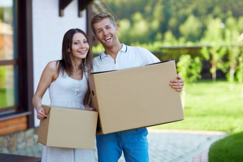 Professional movers handling flat removals in Edgware near a residential building