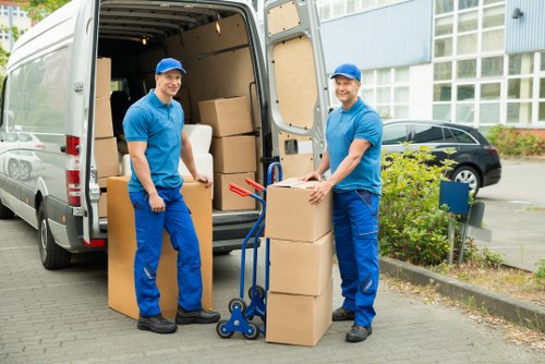 Careful loading of a grand piano using protective equipment during a local move